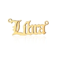 Macro shot of golden stainless steel Libra zodiac charm in gothic style font with side loops - Gold-Libra