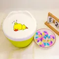 Green laundry pod storage container with white lid and colorful multi-chamber pods - 6-In-1 White Peach (200 Pods/Tub)