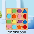 Wooden geometric shape sorting puzzle with colorful blocks on light blue background - Shape Sorting Board