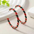 Macro detail of Christmas hoop earrings with red, green and gold spiral stripes - Red and Green in KC Gold
