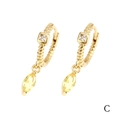 Macro detail of 18K gold earrings with yellow marquise-cut and white square zirconias - Yellow Marquise (ER1139)