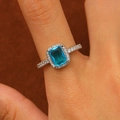 Detailed close-up of a silver ring with a blue rectangular stone and pavé zircon accents - Silver Rectangle Blue Gem Ring (F108)