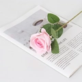 Lifelike single pink velvet faux rose with green leaves on a magazine for home decor - Small Velvet Pink Core