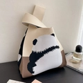 Close-up of a knitted tote bag with a panda pattern and textured fabric surface - Grey-White Back-Facing Bear