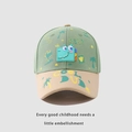 Detail of green kids baseball cap with khaki brim featuring a cartoon dinosaur patch - 52-54 CM / Green
