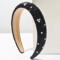 Detail view of padded black headband featuring sparkling star rhinestones on white blocks - Black