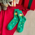 Green coral fleece Christmas socks featuring cartoon stars and holiday character patterns - Star