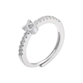 Macro shot of silver adjustable open ring with pavé-set zircons and X-shaped geometric detail - Taurus / Silver