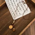 Detail view of retro forest necklace with acorn and wood slice pendants on leather cord - Coffee Wood Chip Acorn Style (6# Necklace)