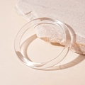 Close-up of minimalist transparent acrylic round bangle on natural pink marble texture - Transparent Round Style (17#)