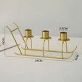 Golden metal sleigh candle holder with three slots for Nordic Christmas decor - 3-Slot Sled Candle Holder / Gold