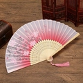 Detailed view of silk folding fan with cherry blossoms, butterflies and pink tassel - Pink Butterfly Flowers