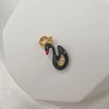 Detail shot of a black swan enamel charm with gold loop and sparkling crystals - Style I (Black Swan)
