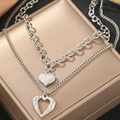 Detail of silver stainless steel double-layer necklace with textured heart pendants - Silver (C7248)