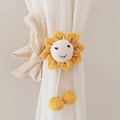 Close-up of yellow sunflower curtain tieback with smiling embroidery and soft beige bow - Ginger Yellow (Smiley Face)