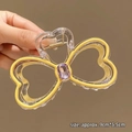 Handheld butterfly hair claw clip in transparent yellow with a purple gemstone accent - Yellow Rhinestone Bowknot