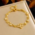 Close-up of golden double-layer chain bracelet with clover pendant and zircon stones - Double Layer Four Leaf Clover Main Pendant Style (B1500)