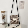 Detail of plush crossbody bag with geometric patterns and rope strap in Zakka style - Wheat Ear