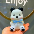 Cute white panda night light with blue checkered bow tie held in hand as a gift - Cool Bear Pink Ribbon