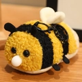 Plush bumblebee squeeze toy keychain in yellow and black striped curly faux fur - Bee
