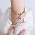 Gold box chain bracelet with sun-shaped evil eye pendant and crystal beads on a wrist - E454-Blue Enamel Gold Color Bracelet