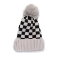 Winter checkered knit beanie with warm fleece pom-pom and ribbed edge for outdoor warmth - Black & White Checkerboard / Off White