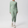 Close-up of light green yoga set with high-waist leggings and long sleeve zipper top - S / Basil Green