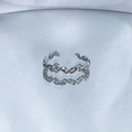 Macro view of adjustable silver twisted chain ring with textured interwoven design - No. 6 Open Ring (Woven Texture)