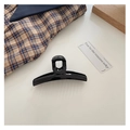 French style black geometric cross streamer hair claw clip on white table - Black