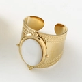 Close-up of golden wide-band ring with oval white gemstone and bohemian patterns - Adjustable Open / White Shell Gold Wide Ring / White