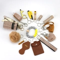 Pink rhinestone self-defense keychain set with 14 pieces including wristlet and fur pompom - Gold