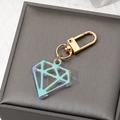 Iridescent acrylic diamond pendant keychain with golden lobster clasp and metallic finish - Laser Blue Gem