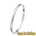 Detailed view of a 4mm domed surface polished stainless steel minimalist bangle bracelet - Simple Domed Surface (Silver) / 4mm Width