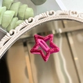 Y2K hot pink star hair clip with glitter finish shown on a decorative mirror - Rose Red Glitter