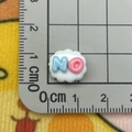 Detailed view of cloud-shaped resin accessory with 'NO' lettering and scale for size - Mini NO Sign