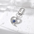 Fonkelende hartvormige sleutelhanger met blauw boze oog en zilveren karabijnsluiting luxe - Zilver Hol Strass Hart Boze Oog