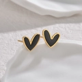 Asymmetrical gold-plated heart stud earrings with black enamel on a white stone base - Black and White Heart