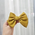 Elegant oversized yellow satin bow hair clip with glossy fabric for a chic hairstyle - Kids Duckbill Clip / Ginger Yellow