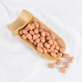Realistic PVC peanut kernels in a bamboo shovel container on white fabric backdrop - Peanuts (500g)