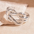 Close-up of polished silver metal cuff bracelet featuring a sculptural knot design - Silver Knot Horse-bit Style / Silver