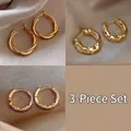 Three-piece gold twisted hoop earrings set with sparkling stones on silk background - 6# Twisted Hoop and Wave Lava Set (AL142)