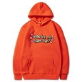 Oversized orange hoodie featuring Who Let Me Have Fun colorful print and front kangaroo pocket - Orange