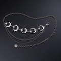 Macro view of gothic layered metal waist chain with crescent moon and sun pendants - Silver Moon Triple Layer