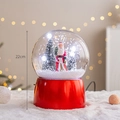 Christmas snow globe featuring Santa Claus and snowy trees in a 22cm red cylinder base - Snowing Globe Santa (Height 22cm)