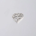 Macro view of a geometric hollow silver heart pendant with a metallic faceted design - 18.4x20mm Heart / Steel Color