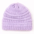 Detail of lavender knit beanie showing vertical rib texture and thick yarn structure - Purple