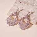 Detail of pink crystal teardrop earrings with leaf patterns on natural stone - Pink