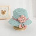 Detailed shot of mint green straw sun hat with 3D pink flower and cherry accents - Hat / Light Blue