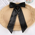 Elegant large black satin bow hair clip with long ribbons on a decorative tray - Duckbill Hair Clips / Black