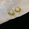Close-up of golden hoop earrings with turquoise stones on white silk fabric background - 11# Silver Earring Post-Gold-Blue (Bohemian Hoop with Blue-Green Gems)